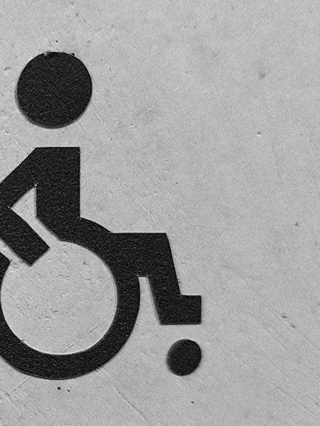 A wheelchair access sign on a wall