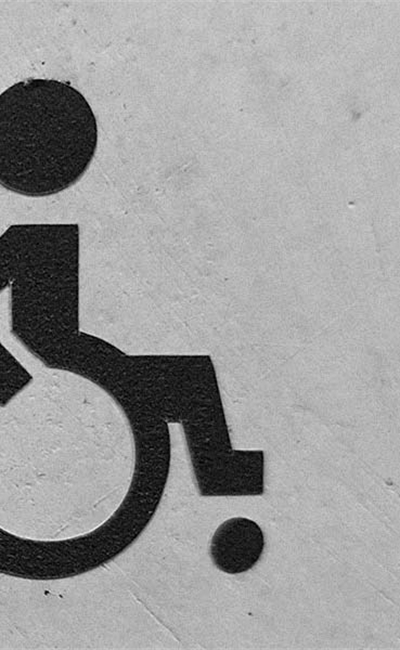 A wheelchair access sign on a wall