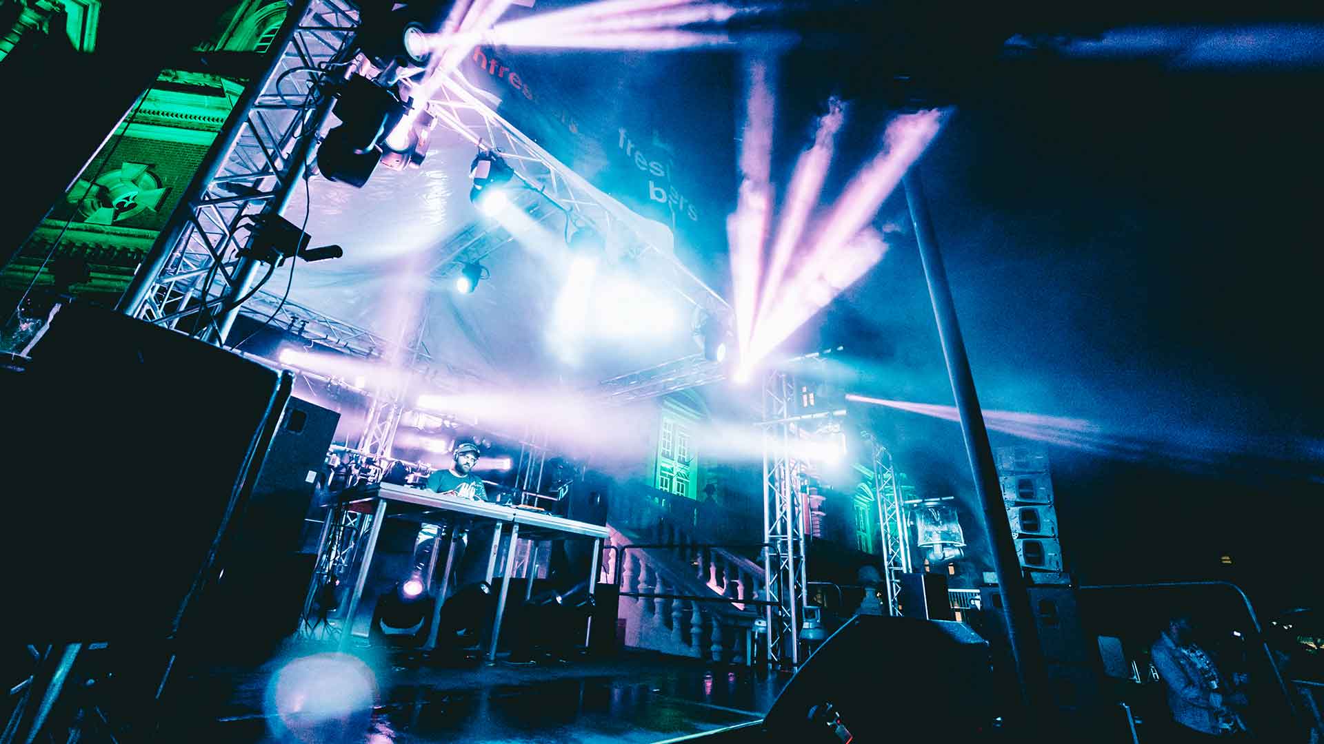 Pink and blue spotlights shining from the stage
