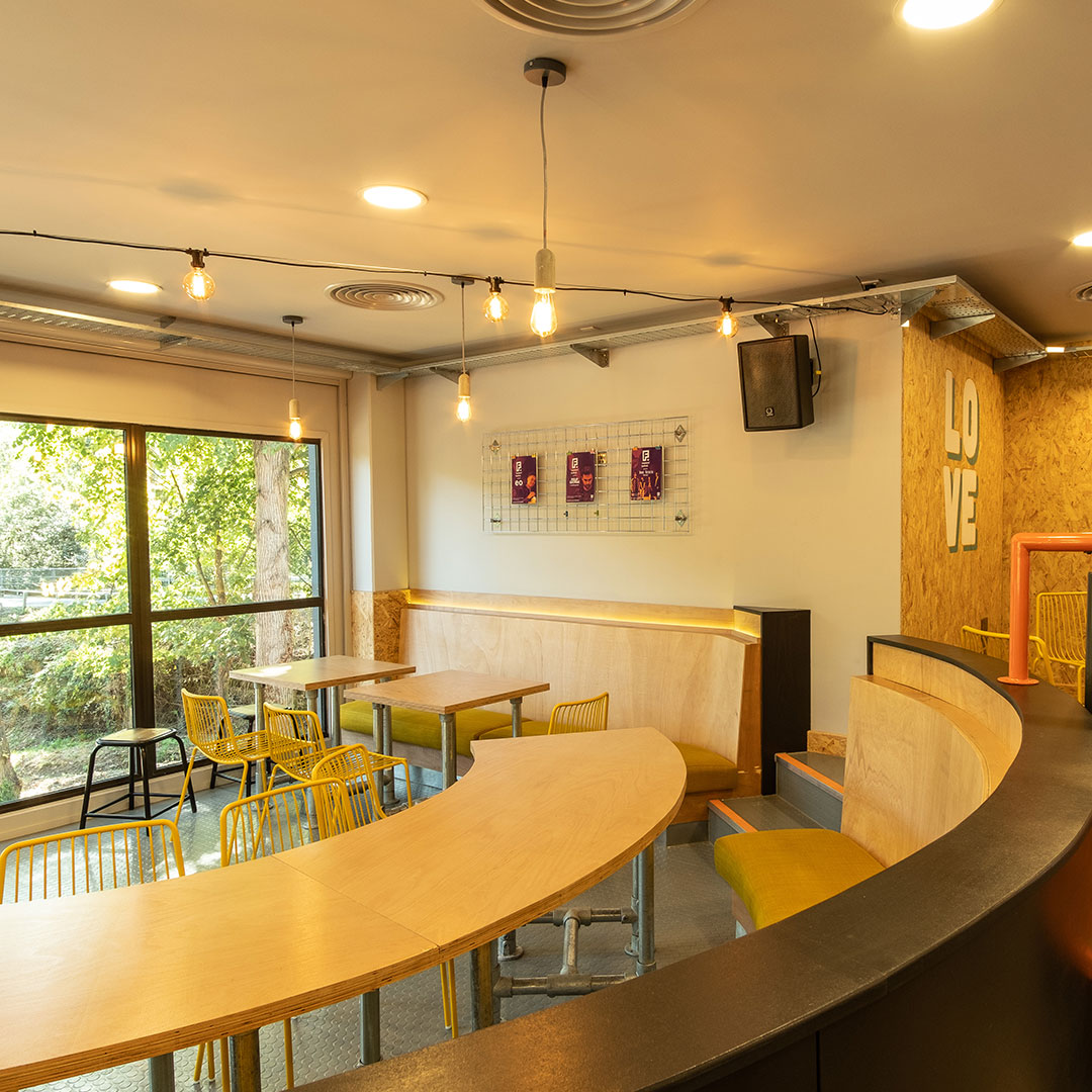 A booth seating area looking out onto trees