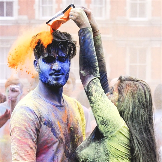 Two people at holi festival