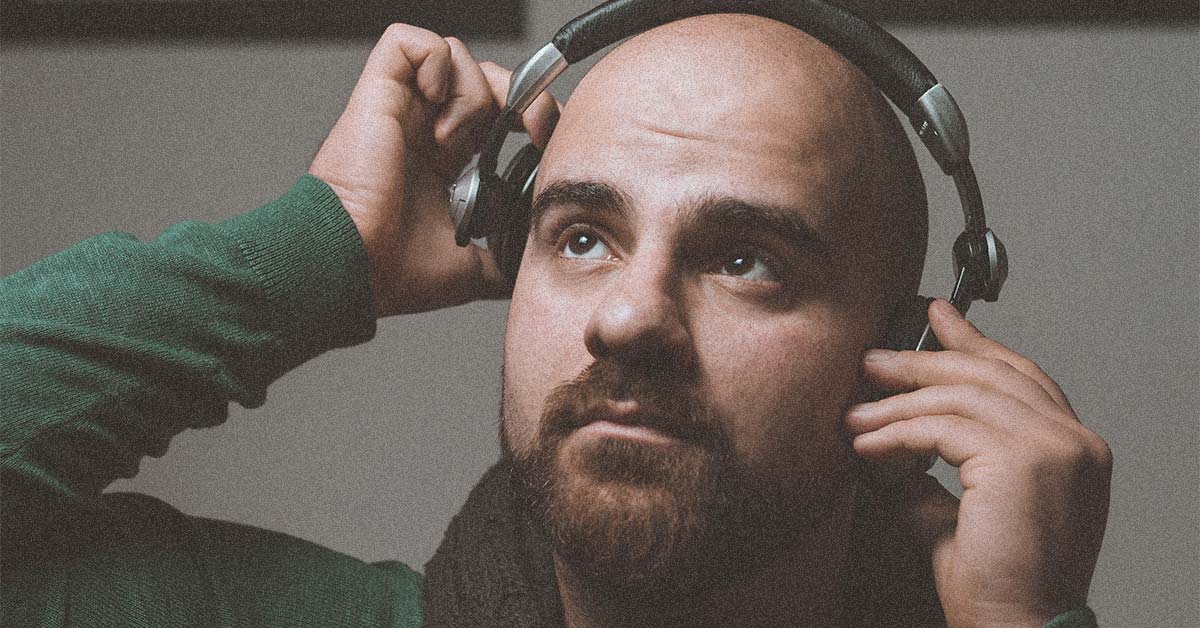 Pammi Pasqual wearing headphones and looking up to the sky