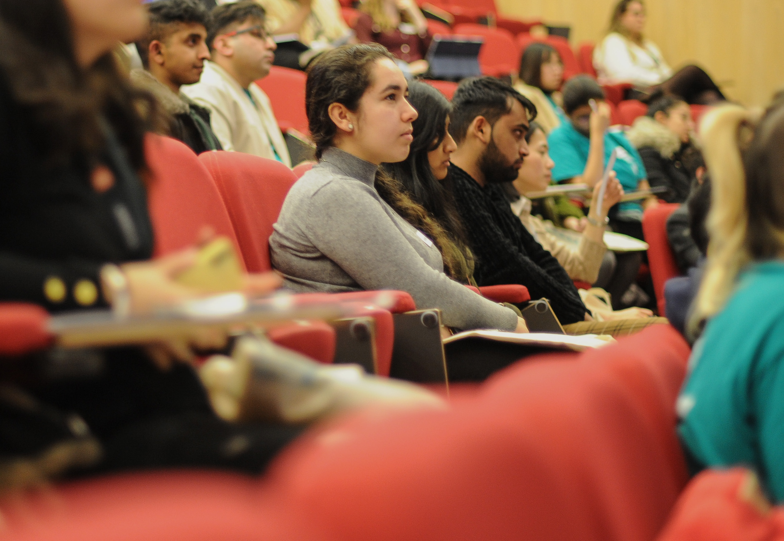Students seated in a lecture theatre